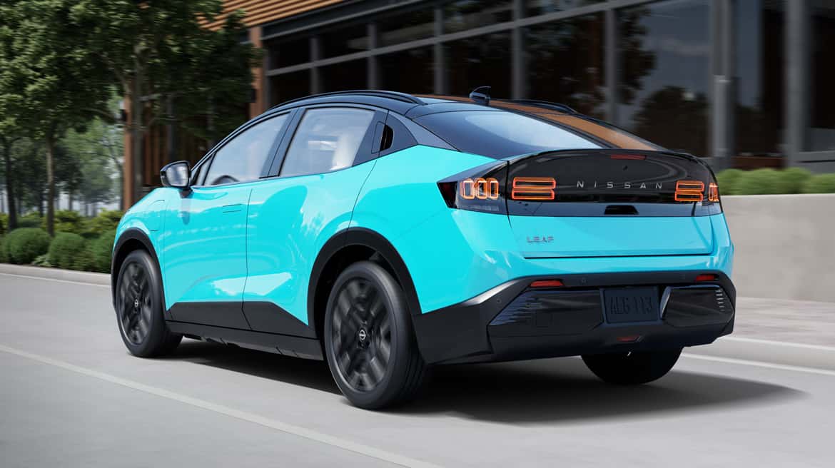 Back angle of new 2026 Nissan LEAF driving down highway