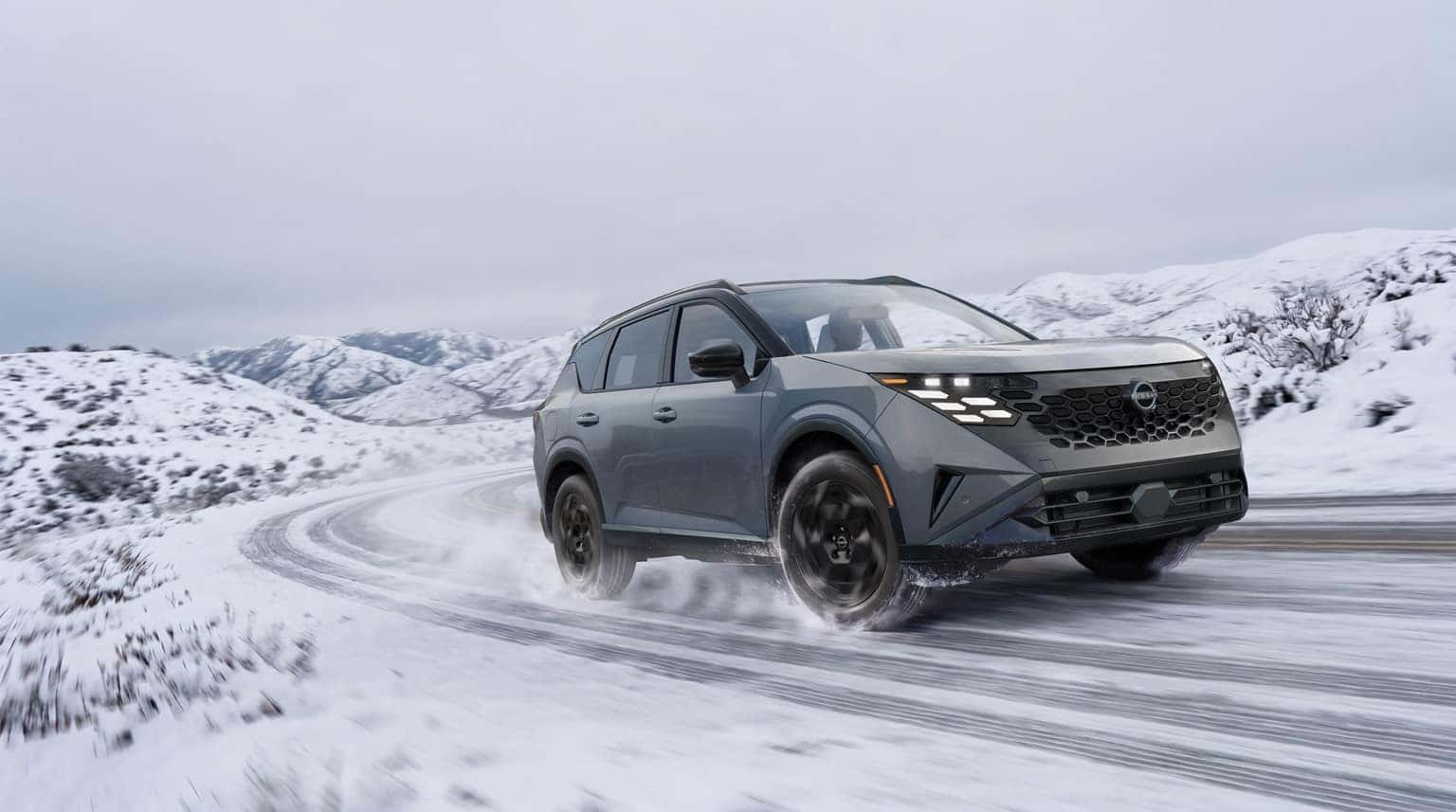2027 Nissan Rogue Hybrid on a snowy road