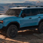 Land Cruiser shown in Heritage Blue with Grayscape roof with available Premium Package and 20-in. alloy wheels Near Me in Covington, LA