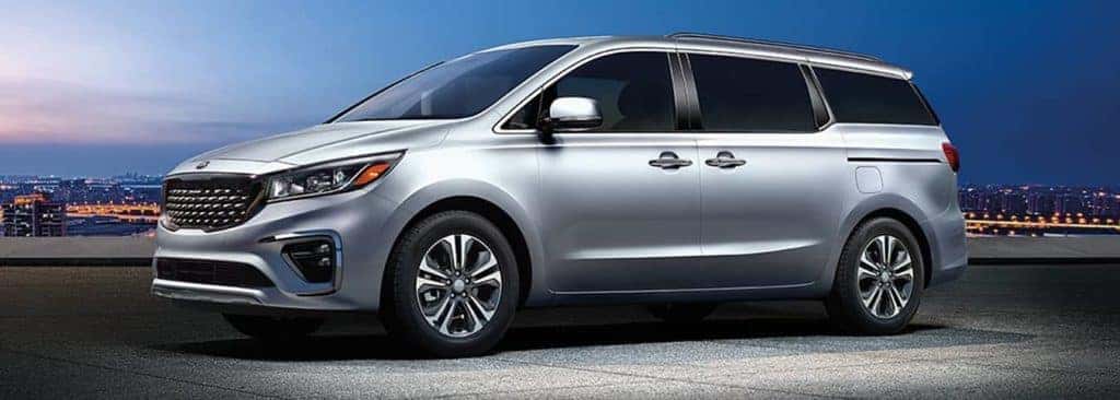 2020 silver Kia Sedona at night