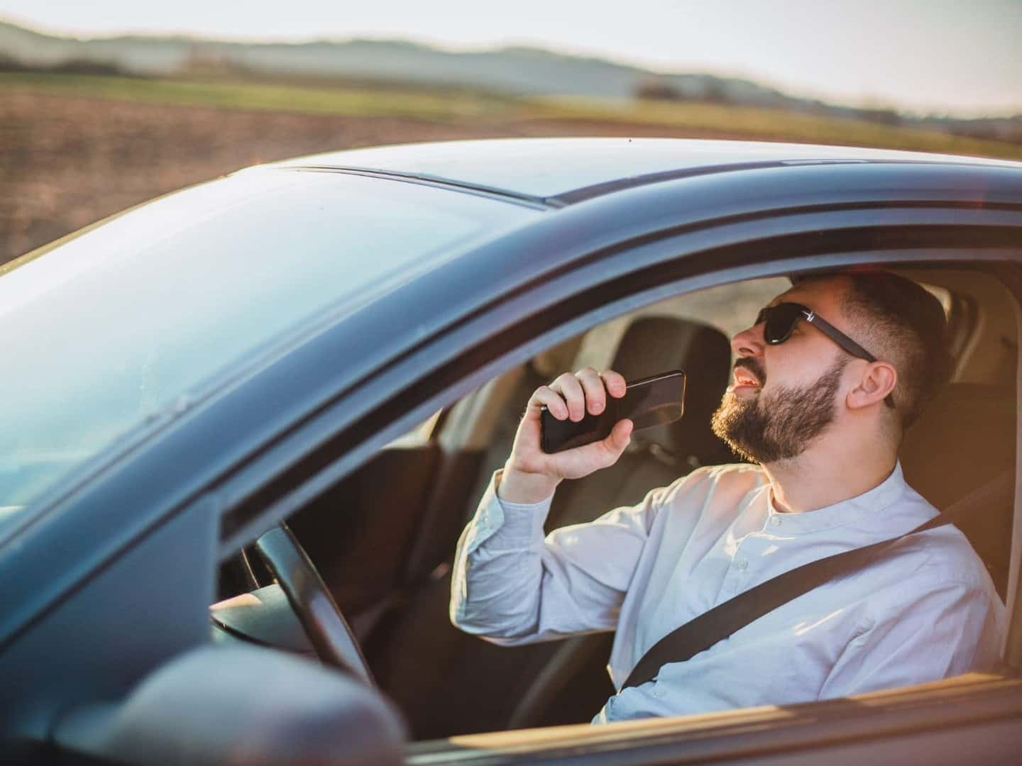 Man singing while he is driving