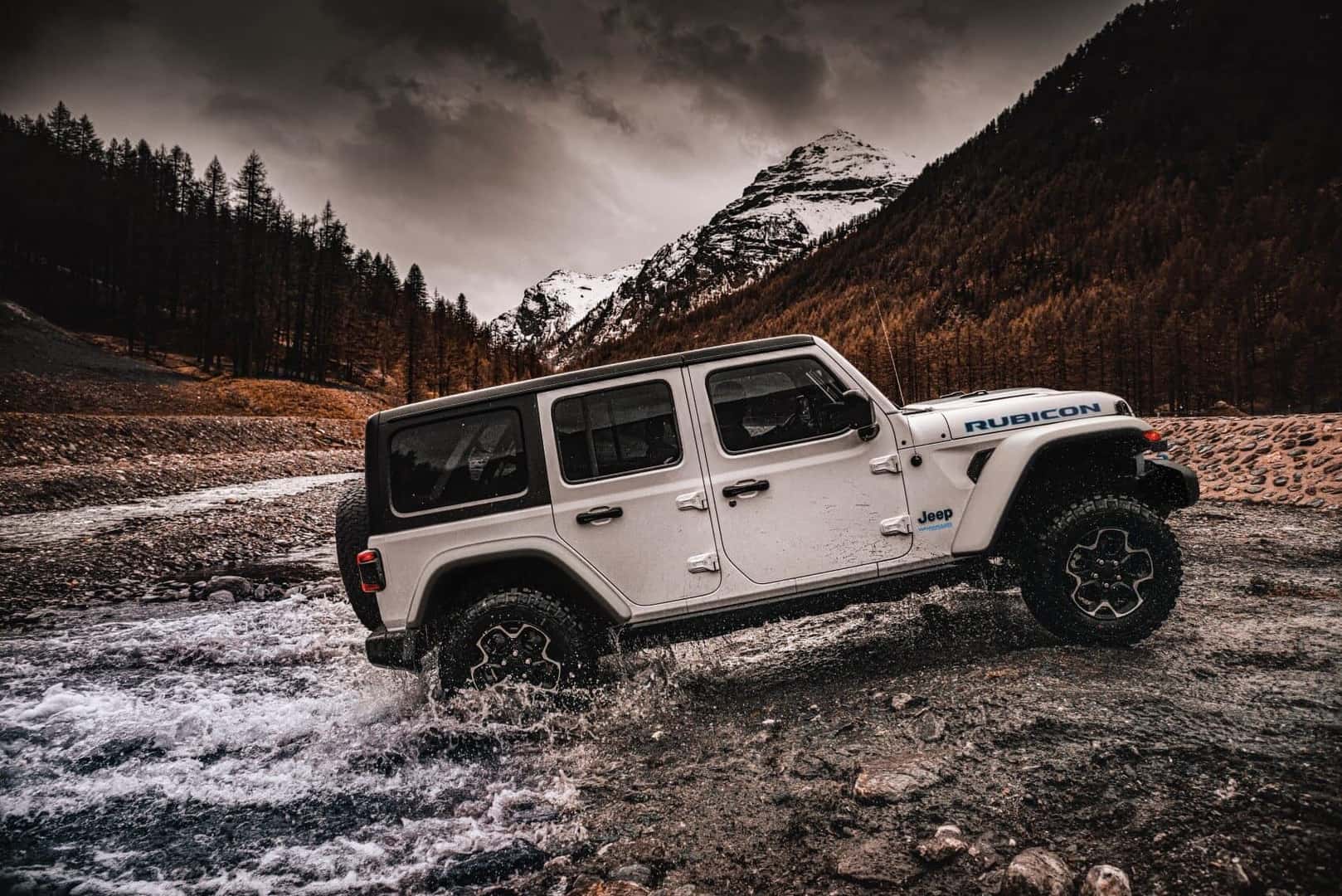 White Jeep Wrangler Offroading Through Water