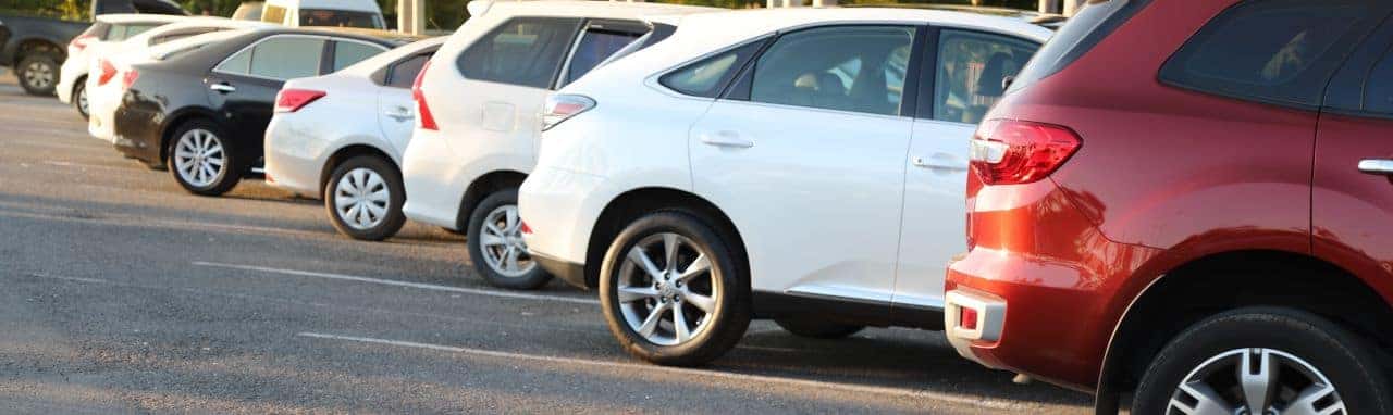 A lineup of used cars, trucks, and SUVs at T's Auto & Truck Sales dealership in Omaha, NE, showcasing reliable and affordable options.