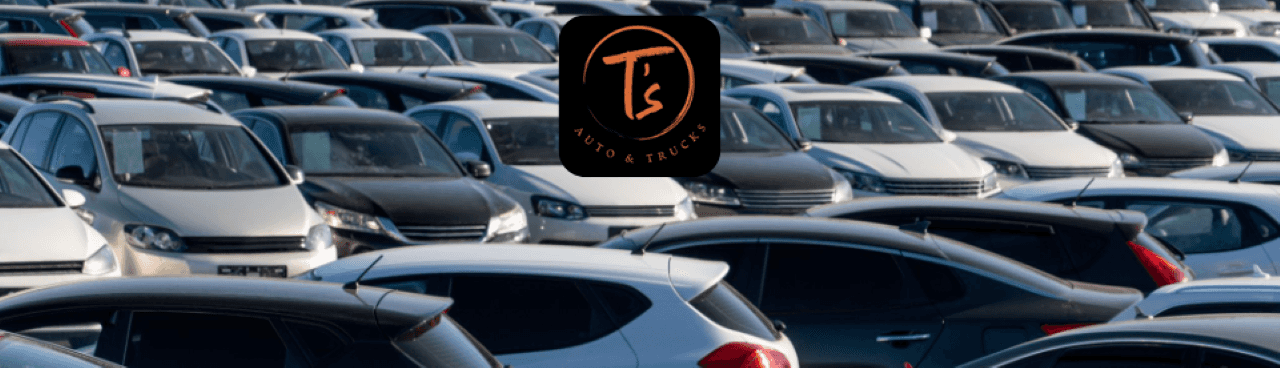 A clean and organized Omaha used car dealership lot at T’s Auto, featuring a wide selection of vehicles.