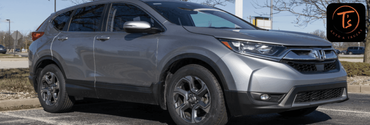 A certified pre-owned Honda CR-V displayed outside T’s Auto & Truck Sales dealership in Omaha, NE